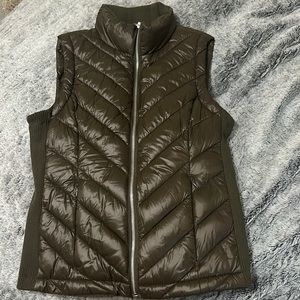 A green olive vest. Maybe for the fall time or even winter for an extra layer.